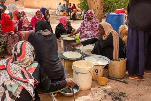 Sudanese women from community kitchens, run by local volunteers, prepare meals for people who are affected by conflict and extreme hunger and are out of reach of international aid efforts, in Omdurman, Sudan, May 13, 2024.